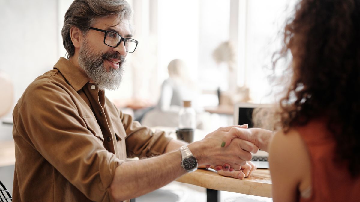 businessperson handshake career change office