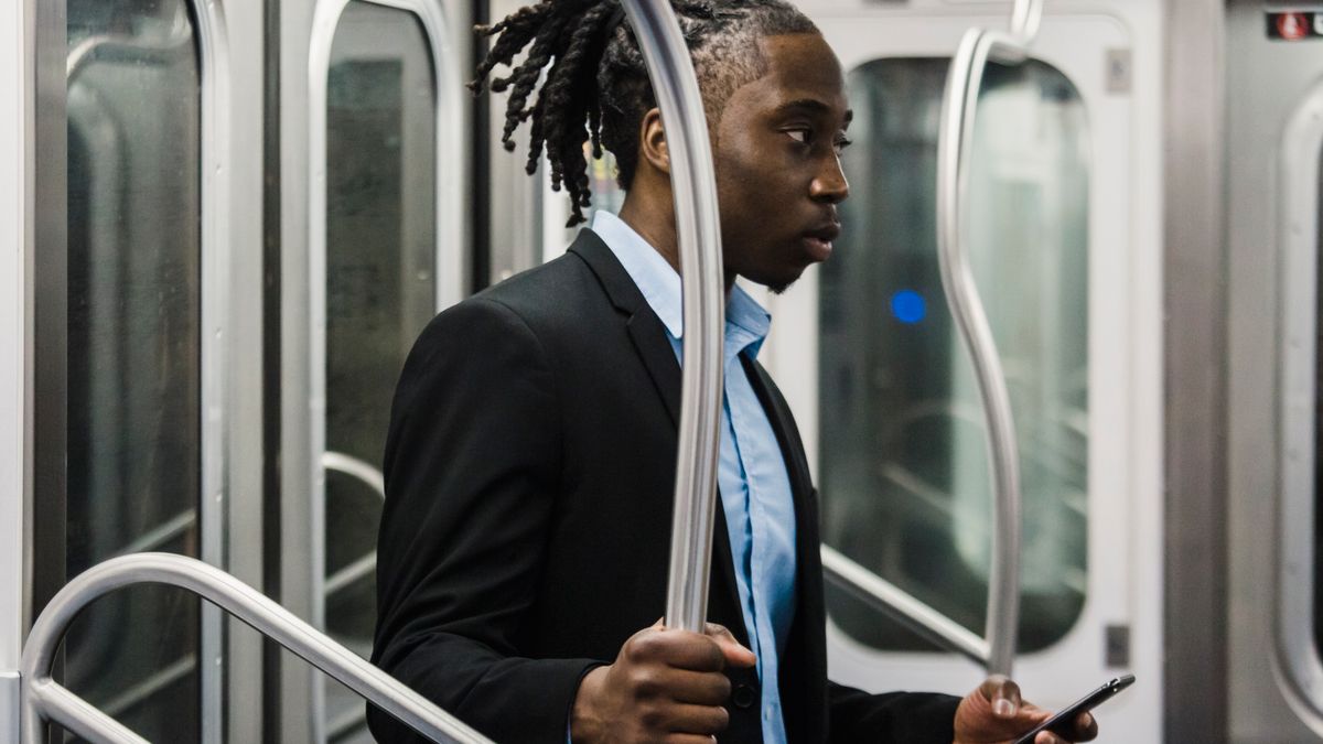 businessman studying on train commute