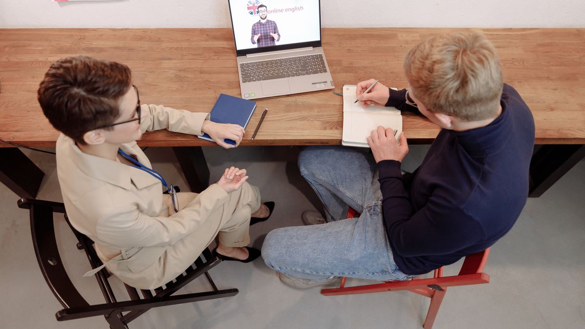 adult having online english conversation lesson on laptop