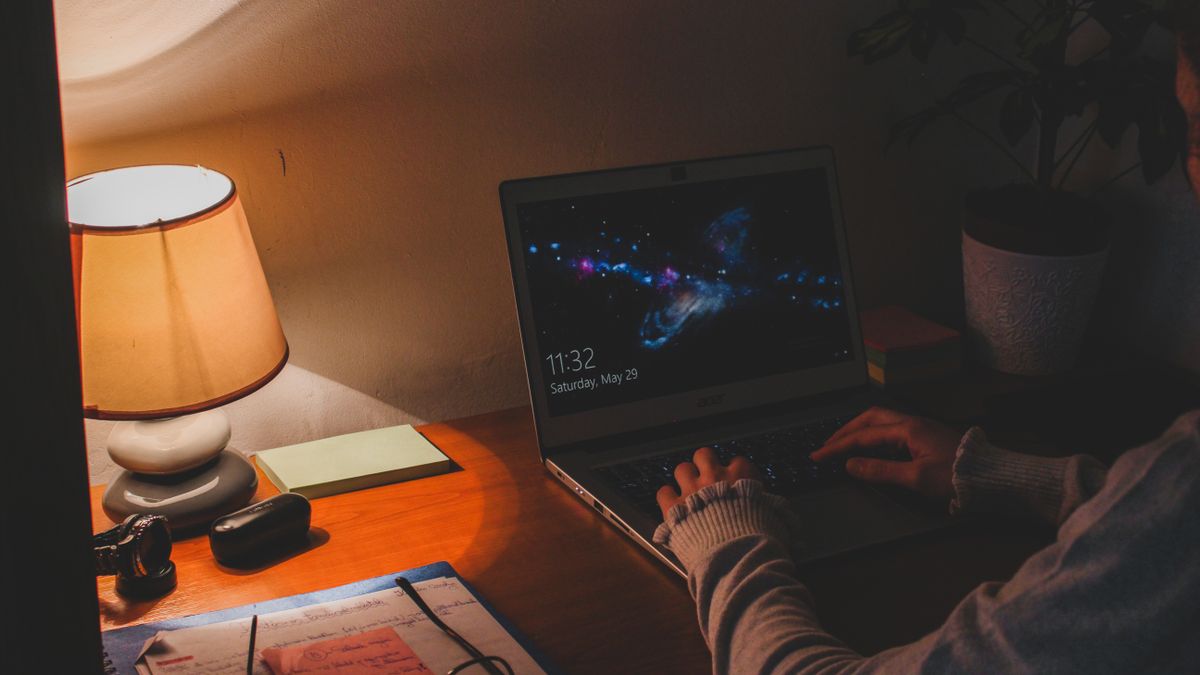 person studying late night notebook