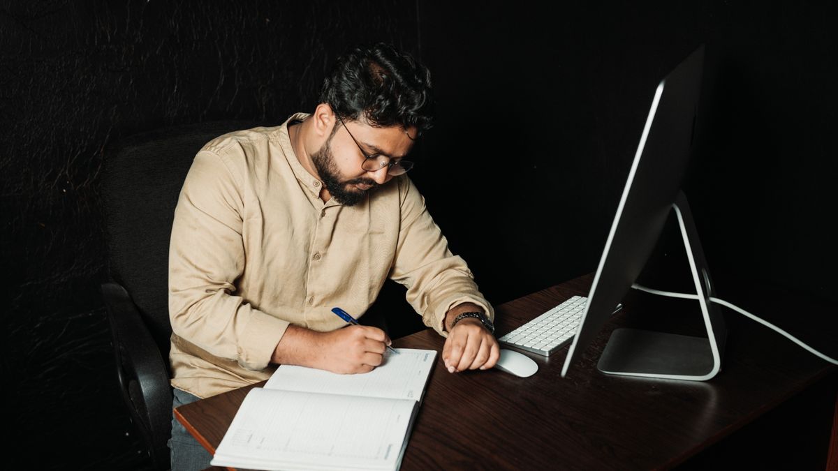 businessman studying at night desk