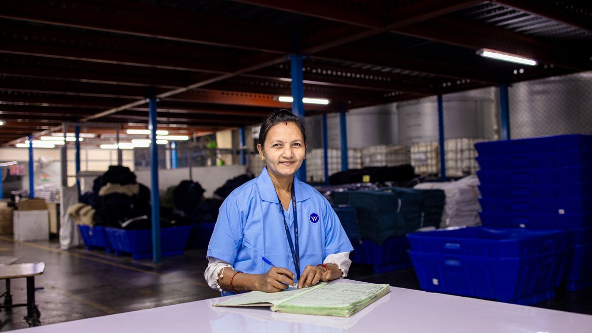 factory worker studying notebook break room
