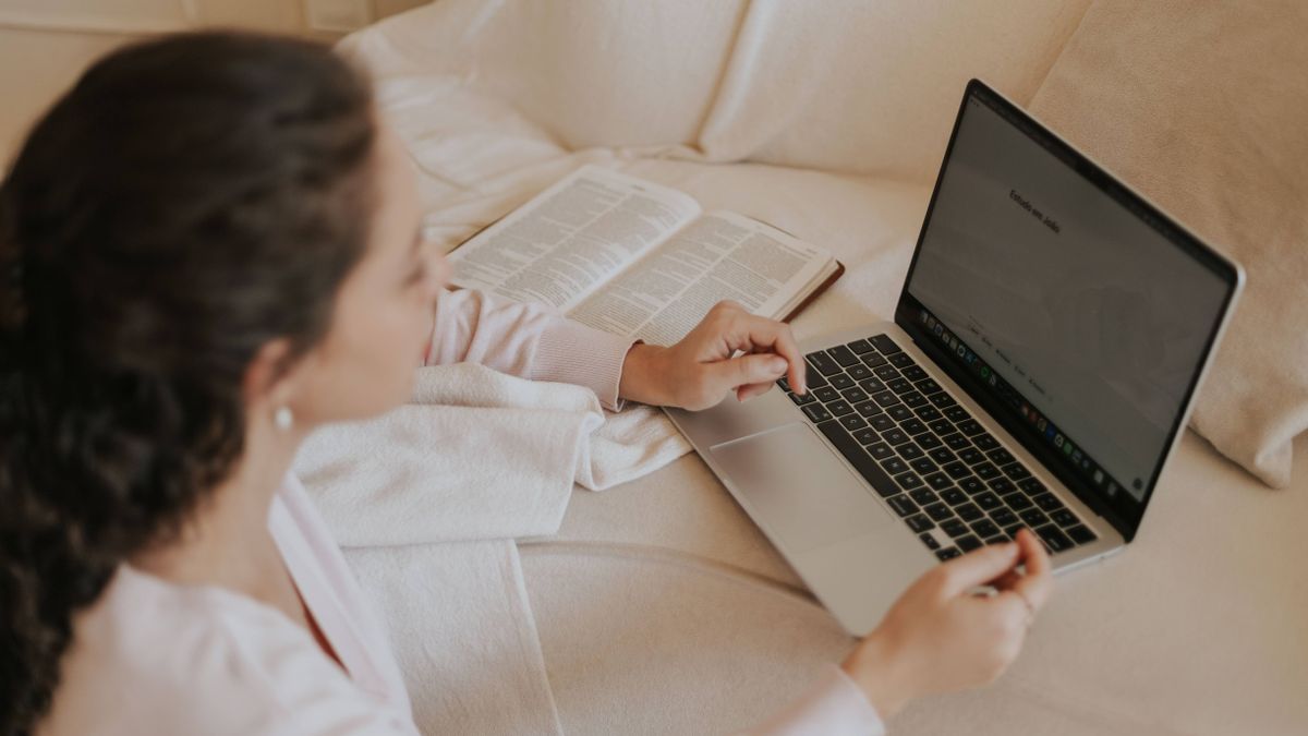 woman studying laptop online course home