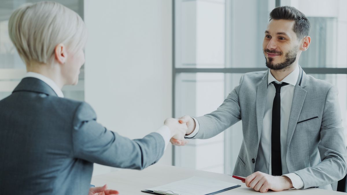 businessperson office success handshake