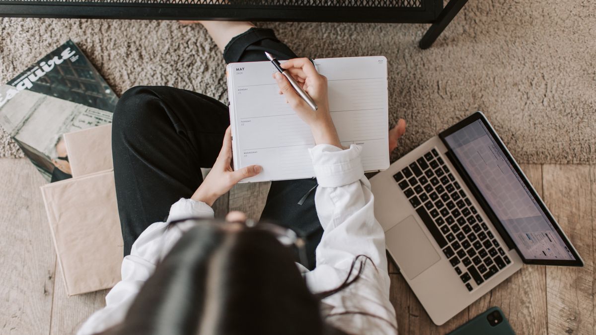 woman studying notebook laptop time management