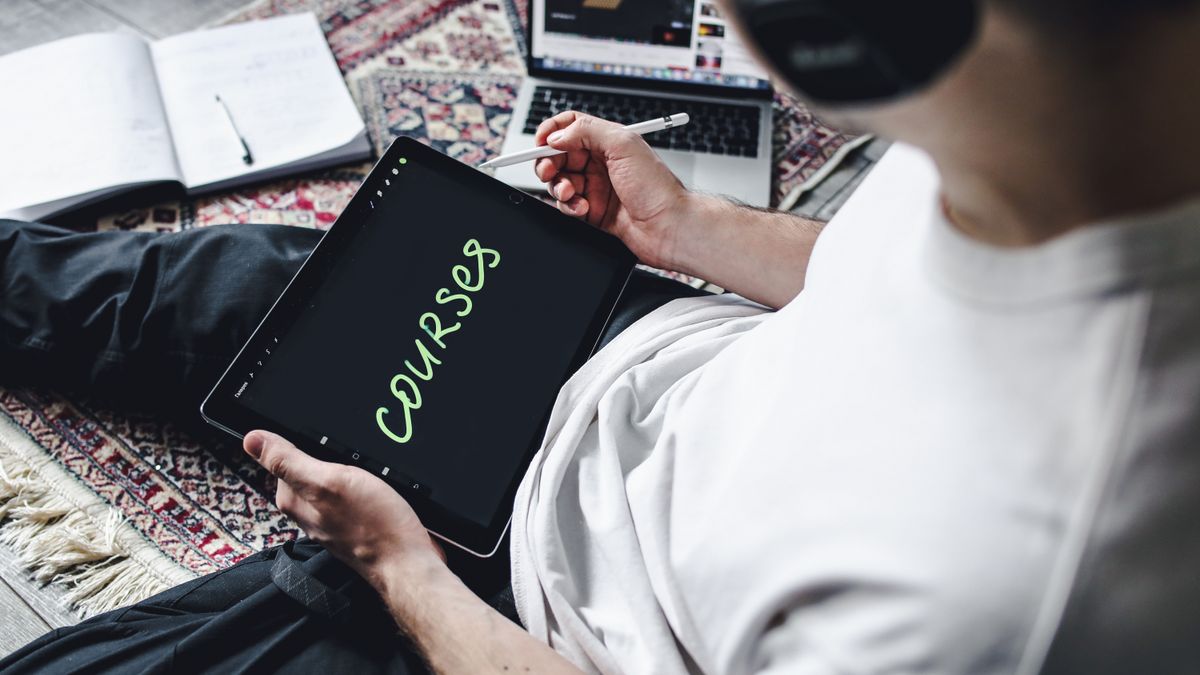 person studying online course laptop