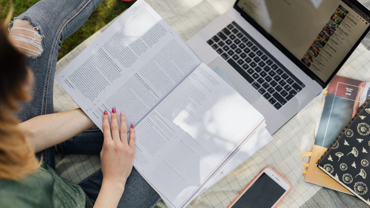 woman studying online course laptop notebook