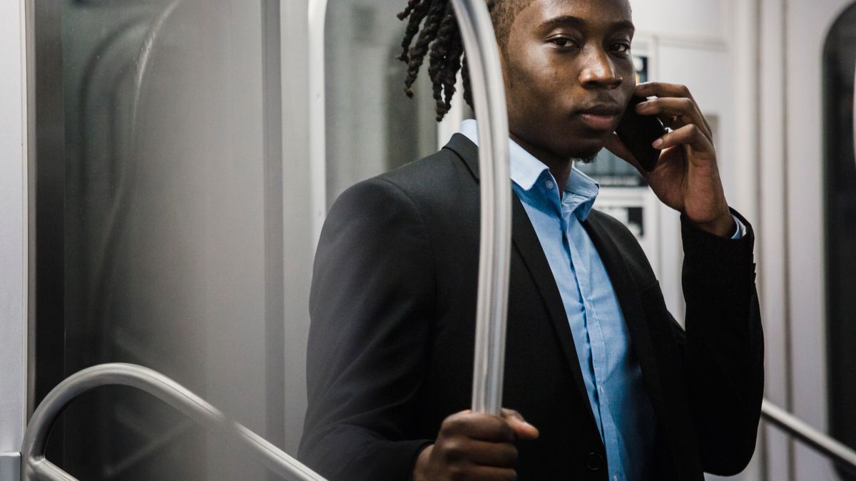 office worker studying smartphone train commute