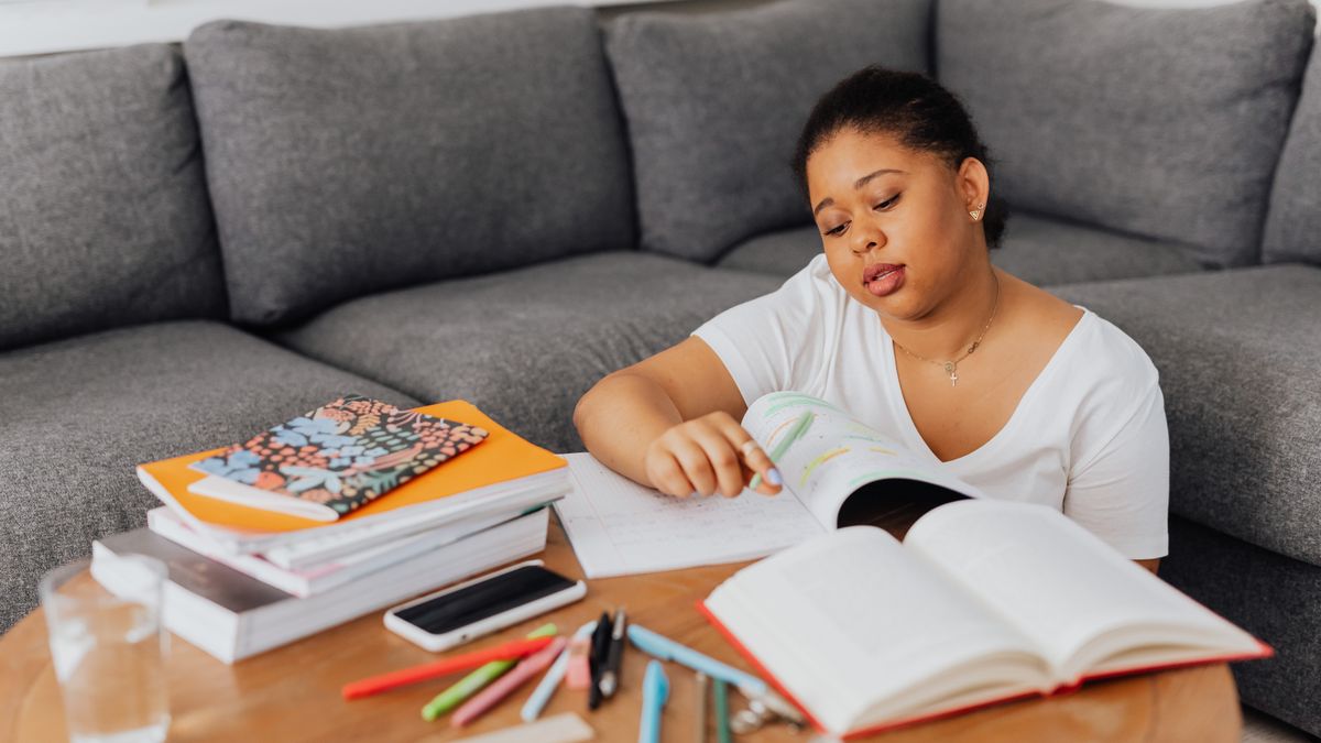 woman studying at home notebook