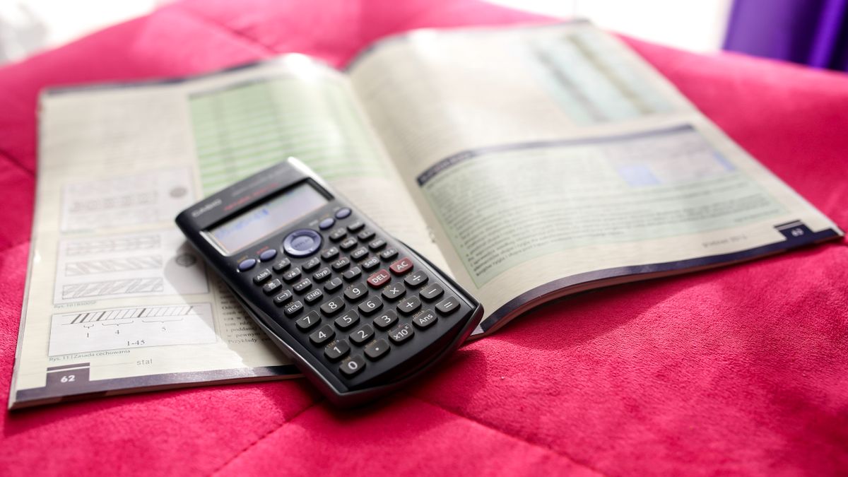 statistics textbook, calculator, notebook