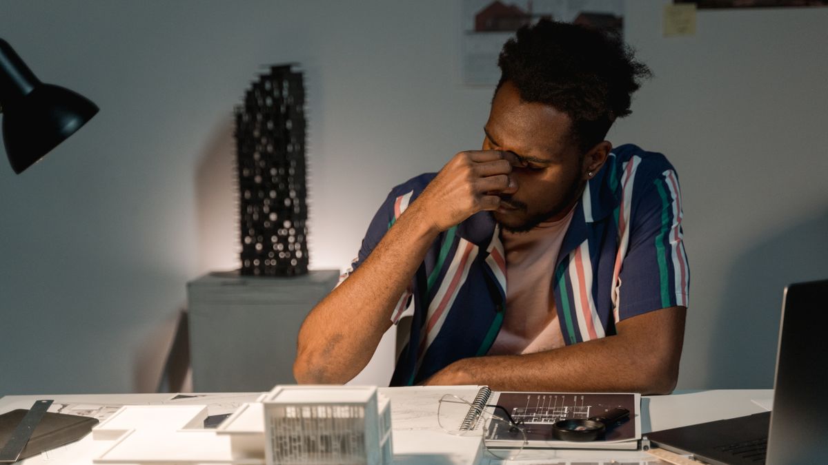 frustrated student studying late at night