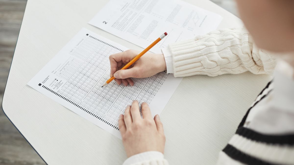 exam candidate marking answer sheet