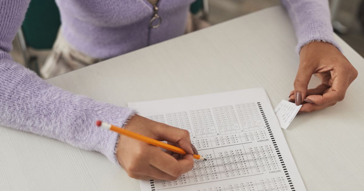 exam candidate marking answer sheet