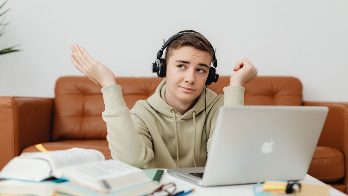 student watching online course video lecture on laptop