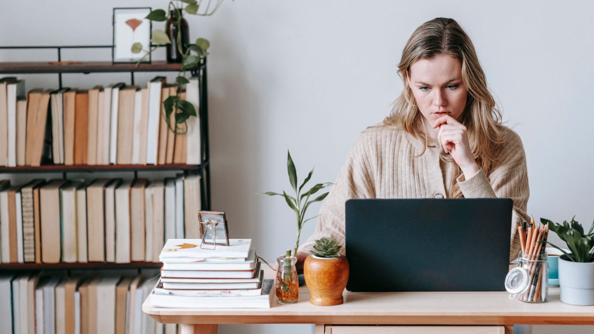 woman studying online course at desk