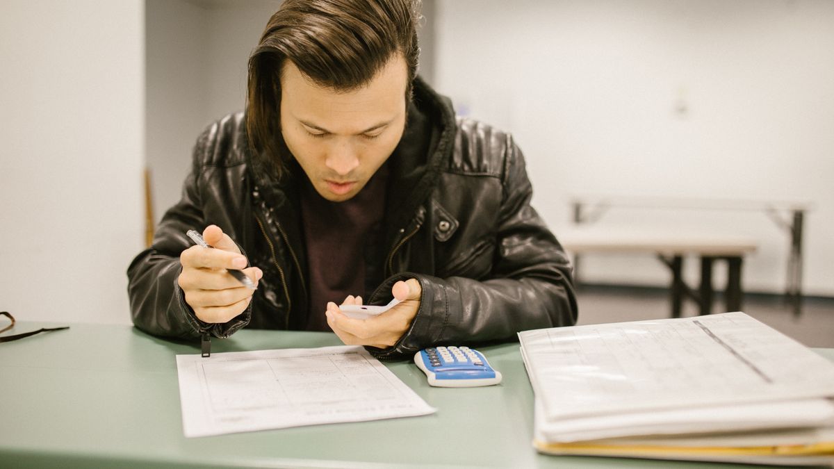 student solving exam practice test paper