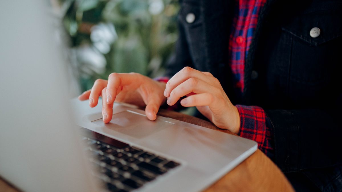 person comparing online course options on laptop