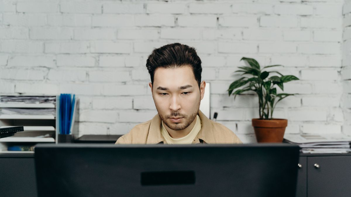 office worker studying computer certification exam