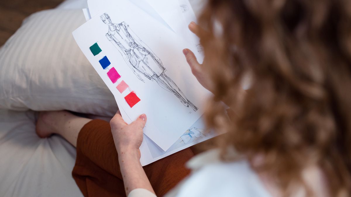 fashion stylist choosing fabric color swatches