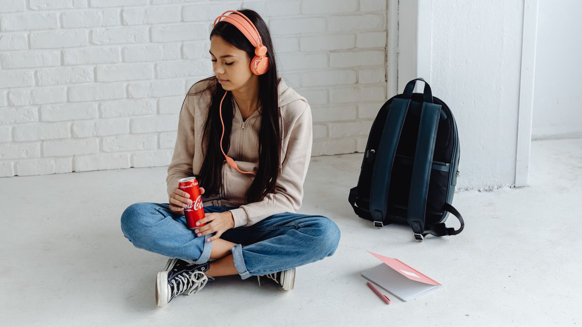 student wearing headphones listening practice test