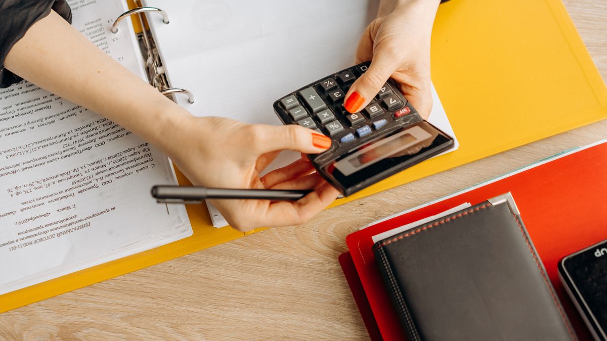 accounting textbooks calculator desk