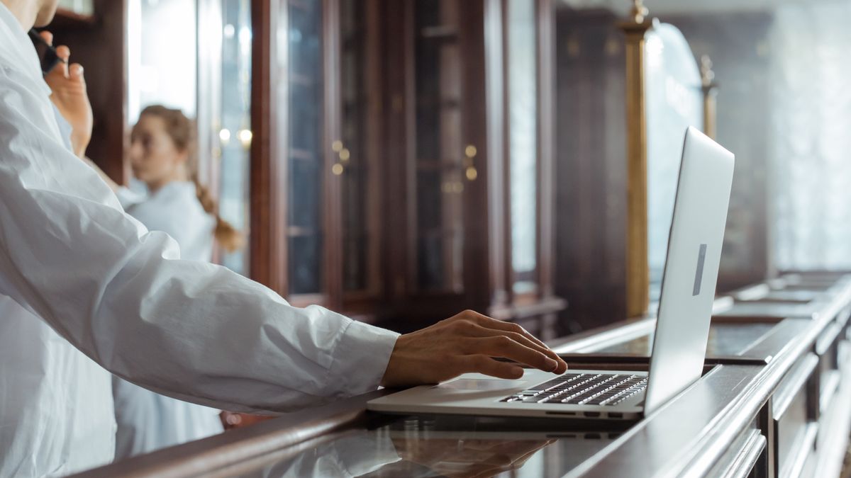 person researching certification options on laptop