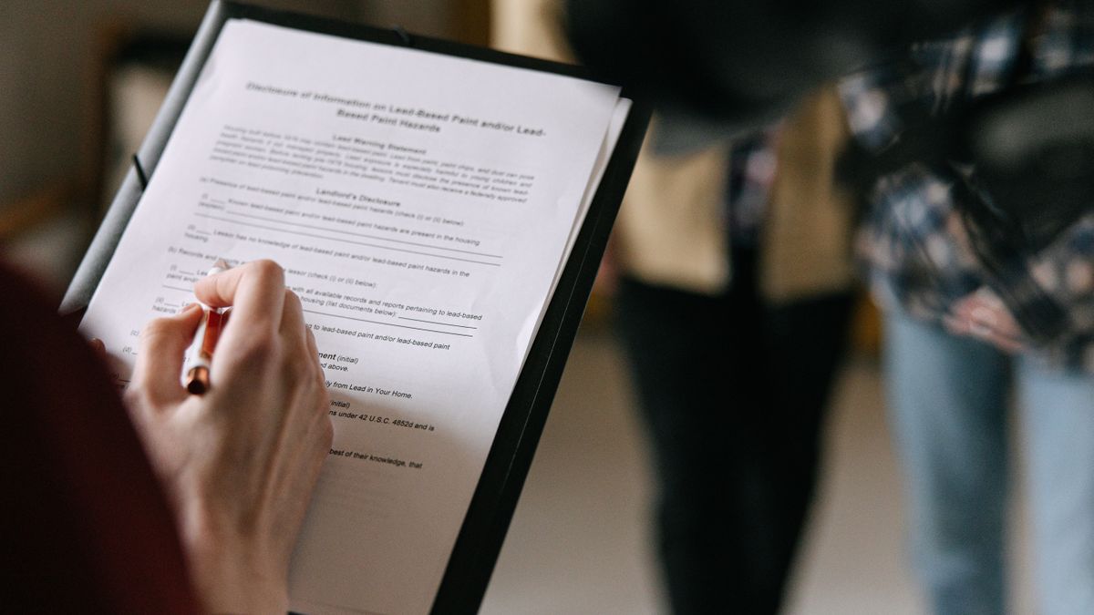 caregiver reviewing exam paperwork checklist