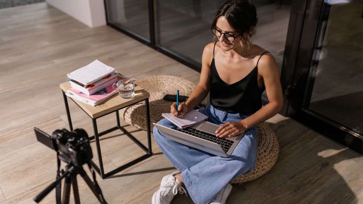 woman studying online course laptop home