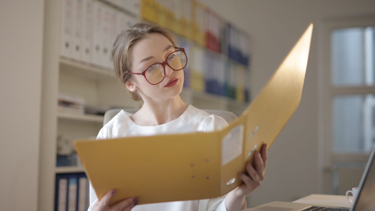 office worker reviewing certification documents