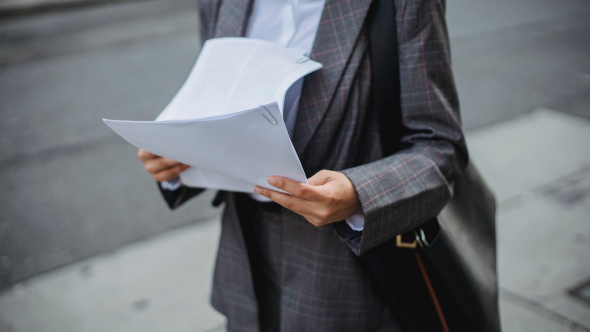 office worker reading document notebook