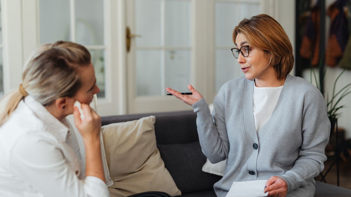 counselor listening to client office session