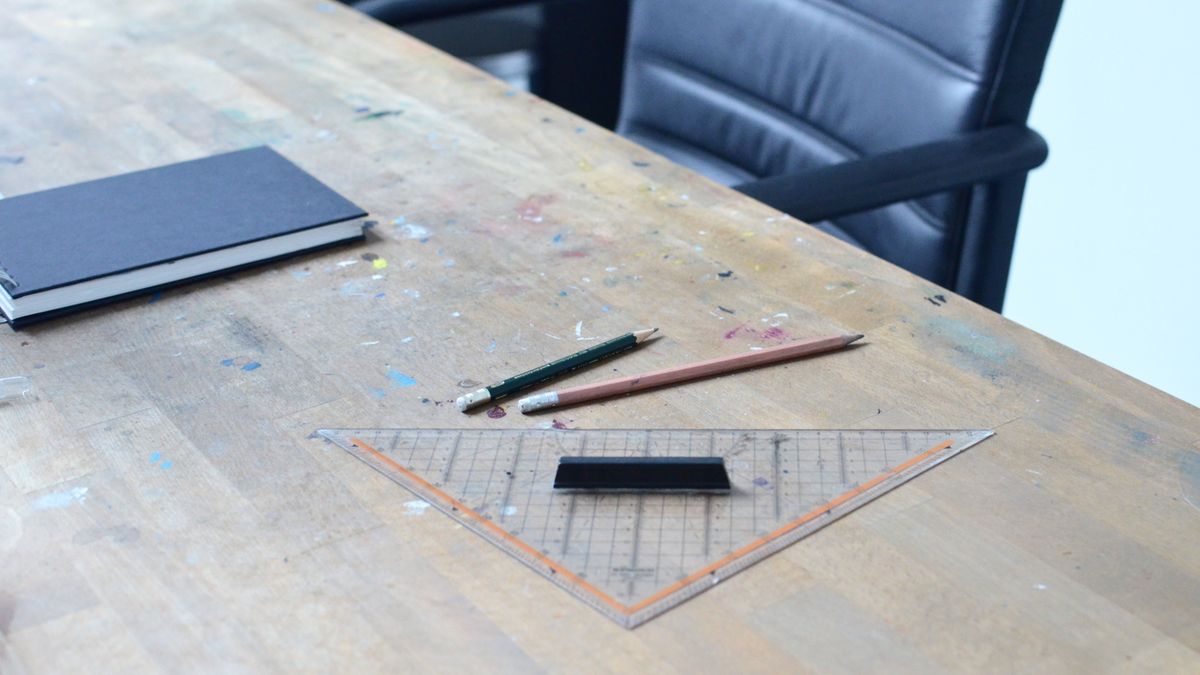 study desk with architecture textbooks and ruler