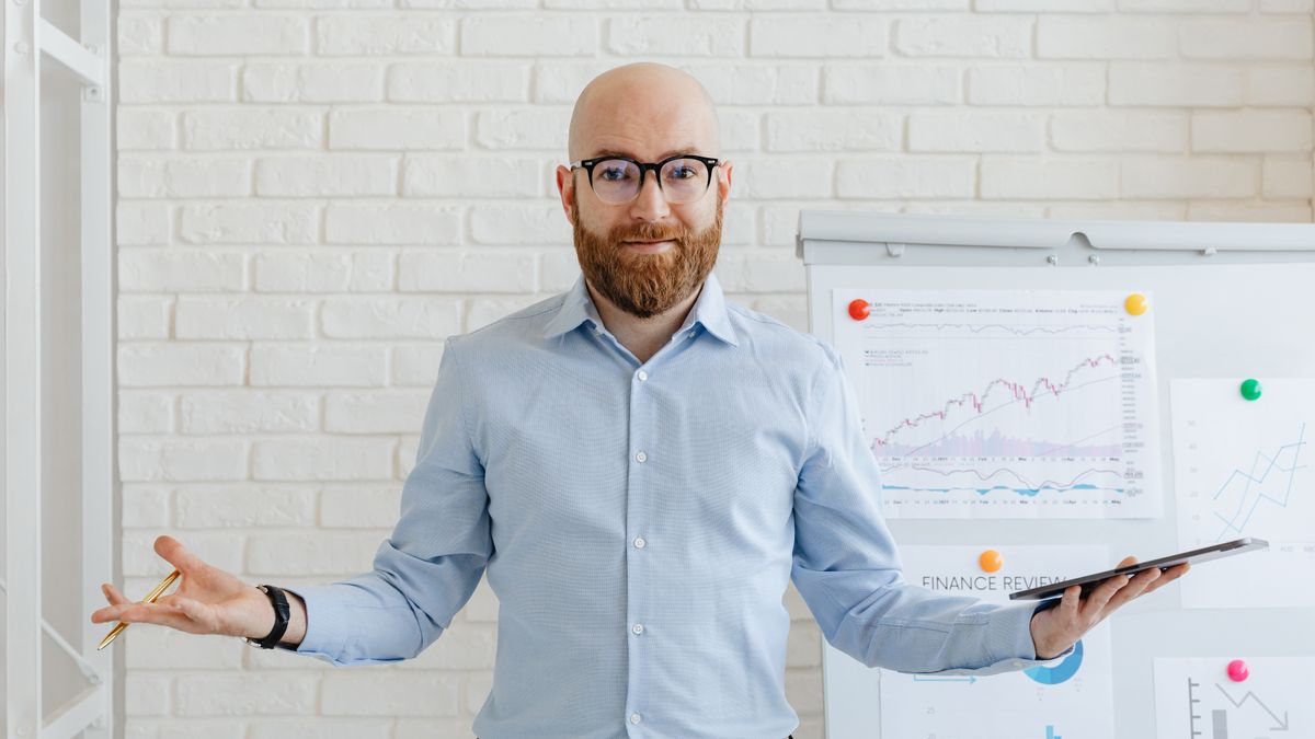 businessman standing at crossroads decision path