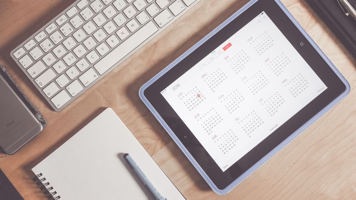 calendar planner on desk with pen