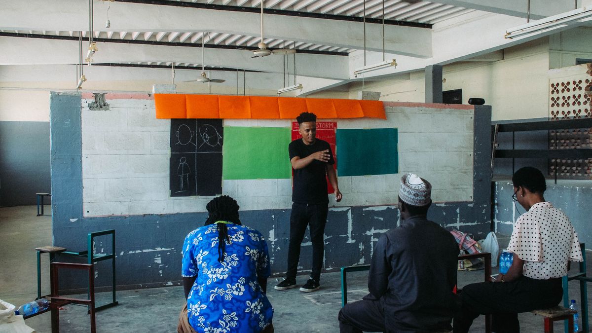 drone flight instructor teaching student indoor classroom
