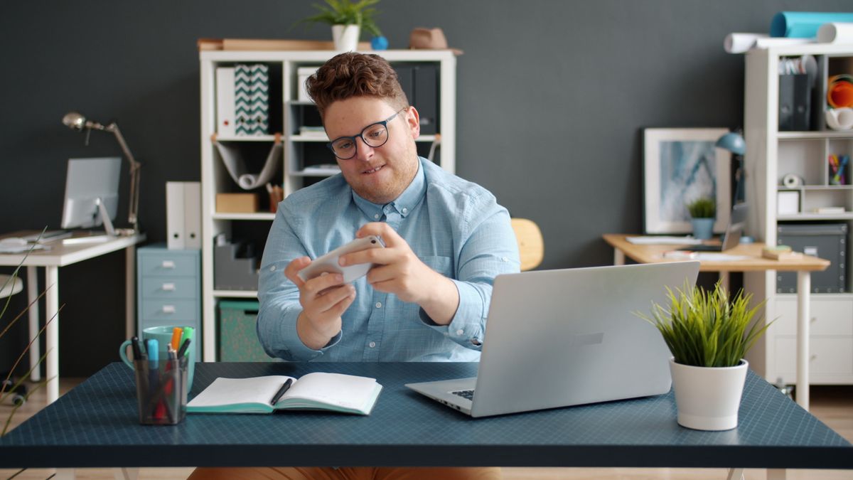 office worker studying with laptop at desk