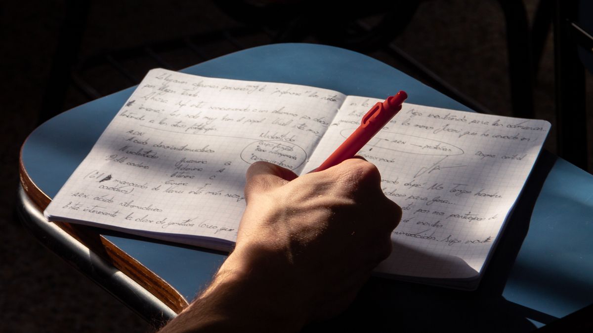 person studying disaster preparedness manual at desk