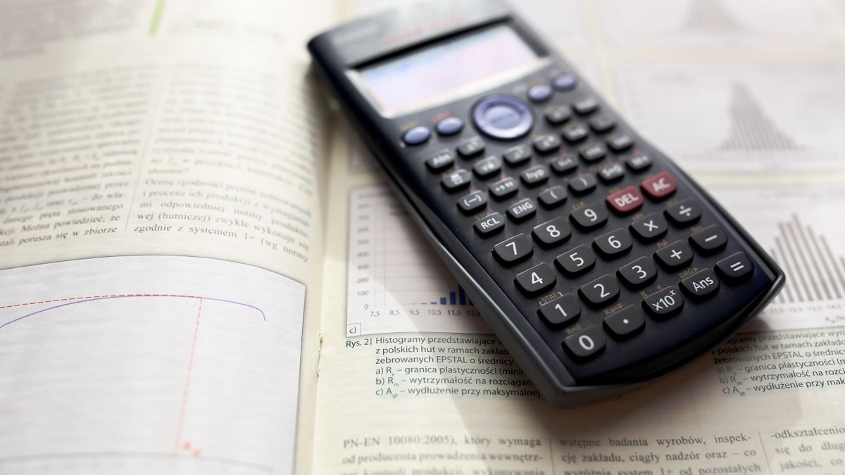 study desk with textbooks calculator