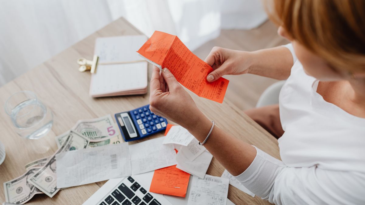 calculator and receipts on desk budget planning