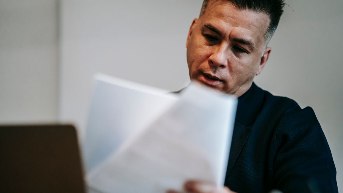 fitness trainer reviewing certification cost documents