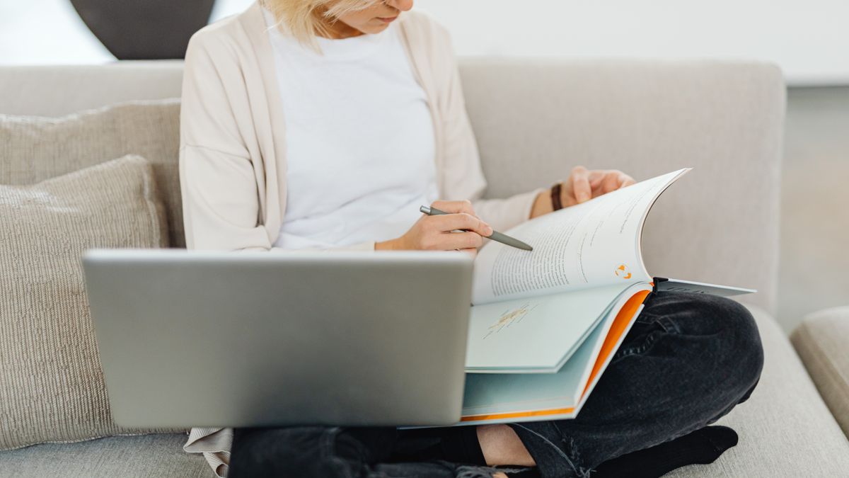person studying thick fitness textbook