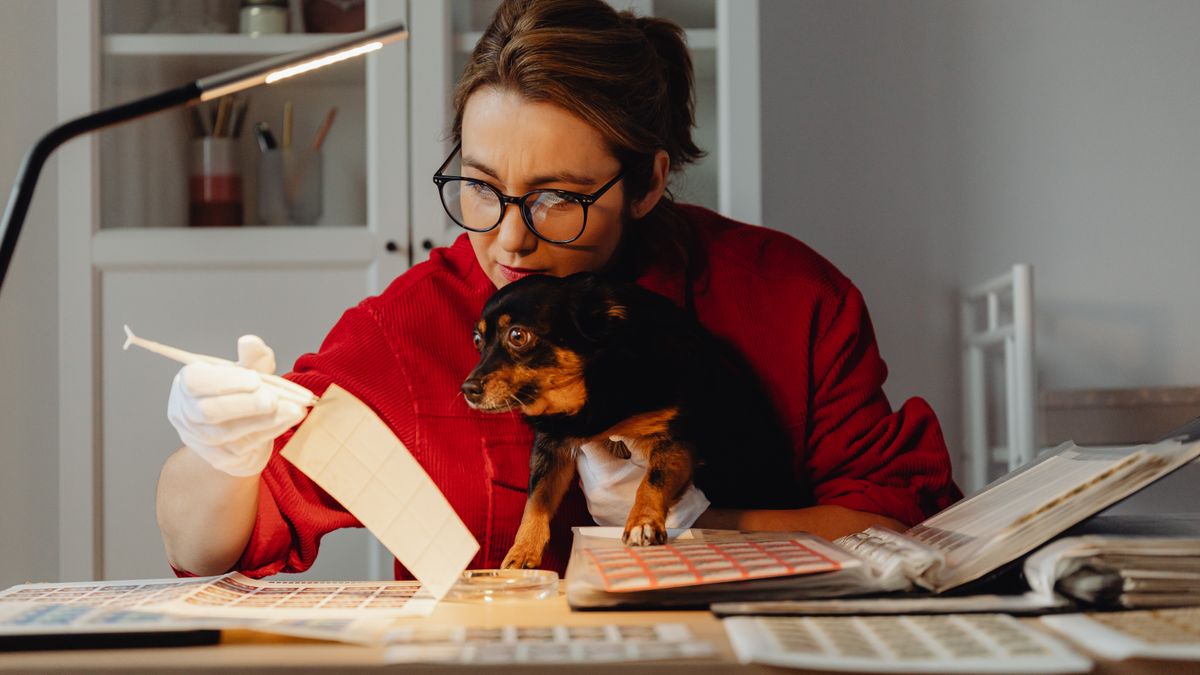 person studying pet care textbook desk