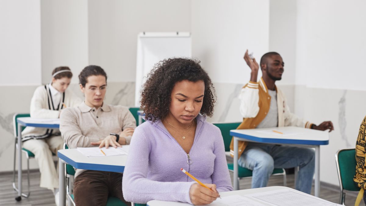 exam candidates writing test classroom