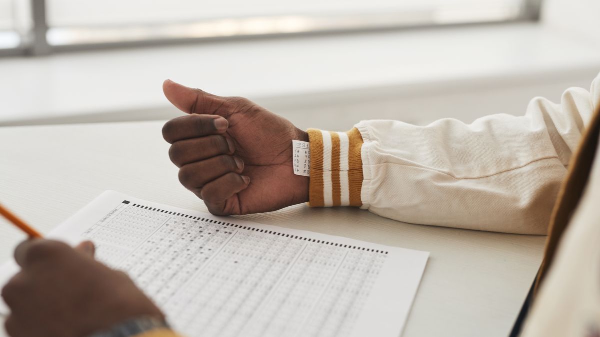 person taking multiple choice exam with pencil