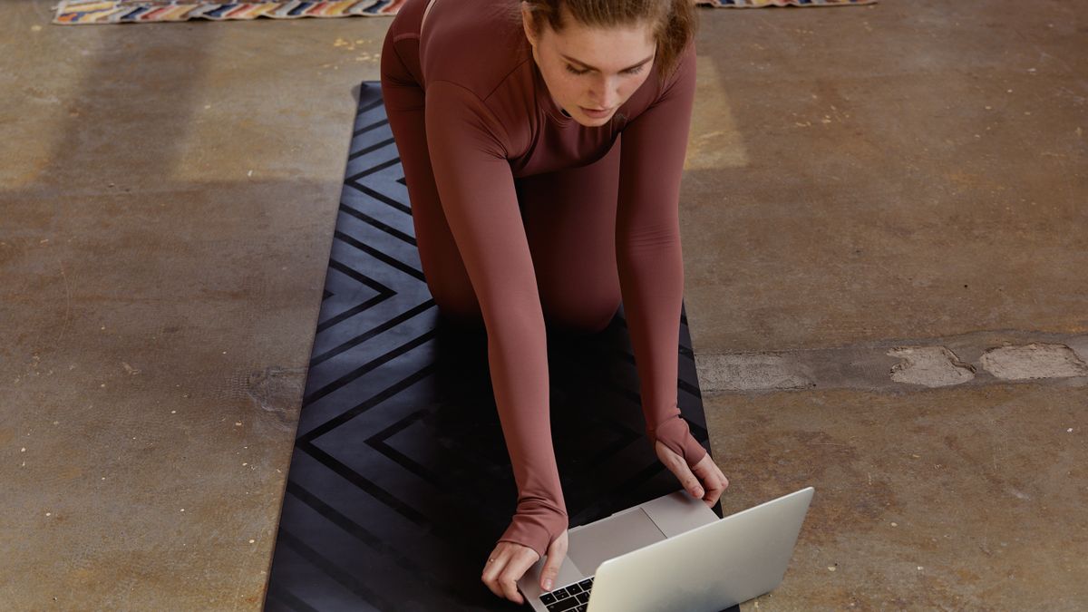 yoga mat book laptop home practice