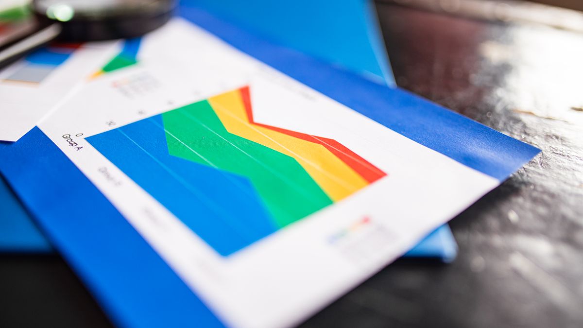 comparison chart documents on office table