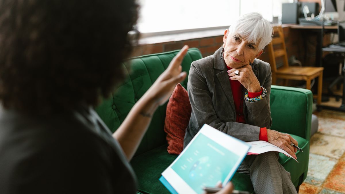 social worker consulting elderly person office