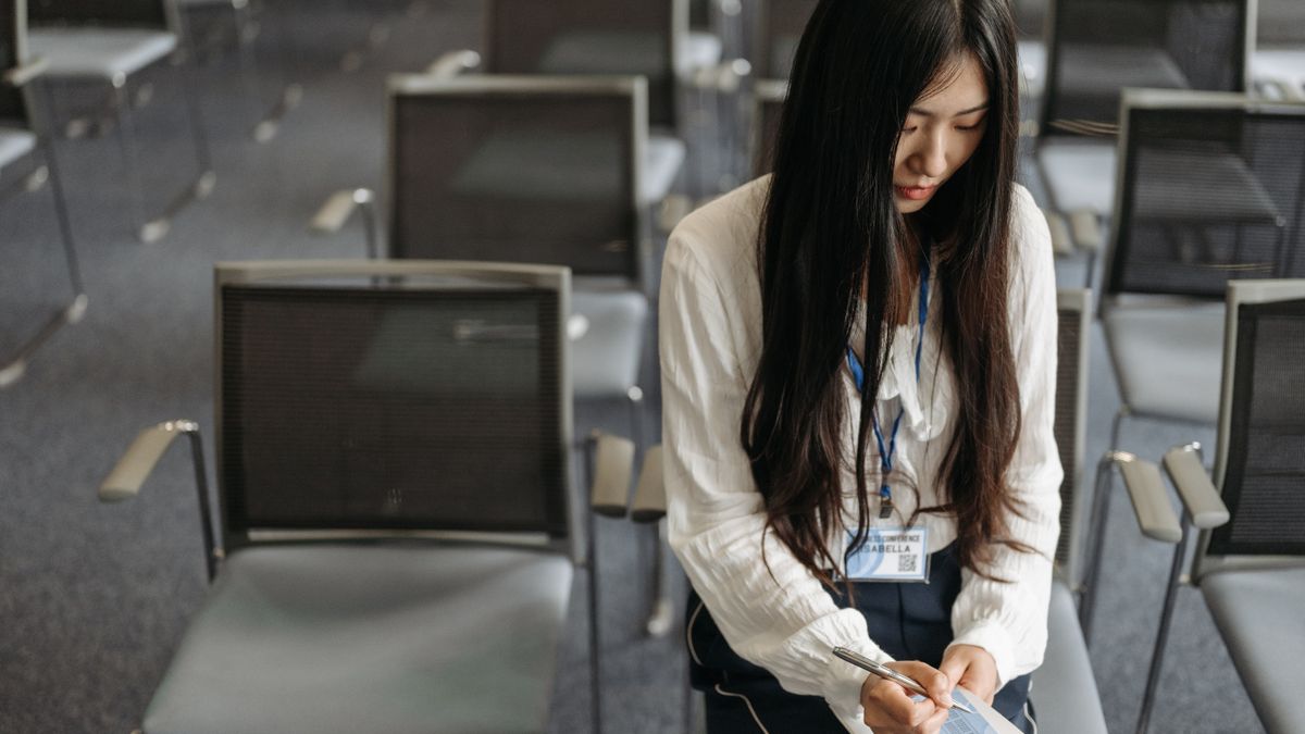 person taking notes disaster prevention seminar