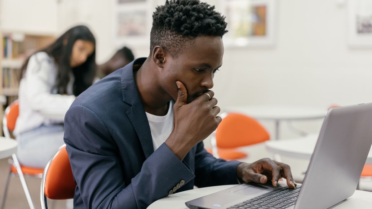 student studying online course laptop