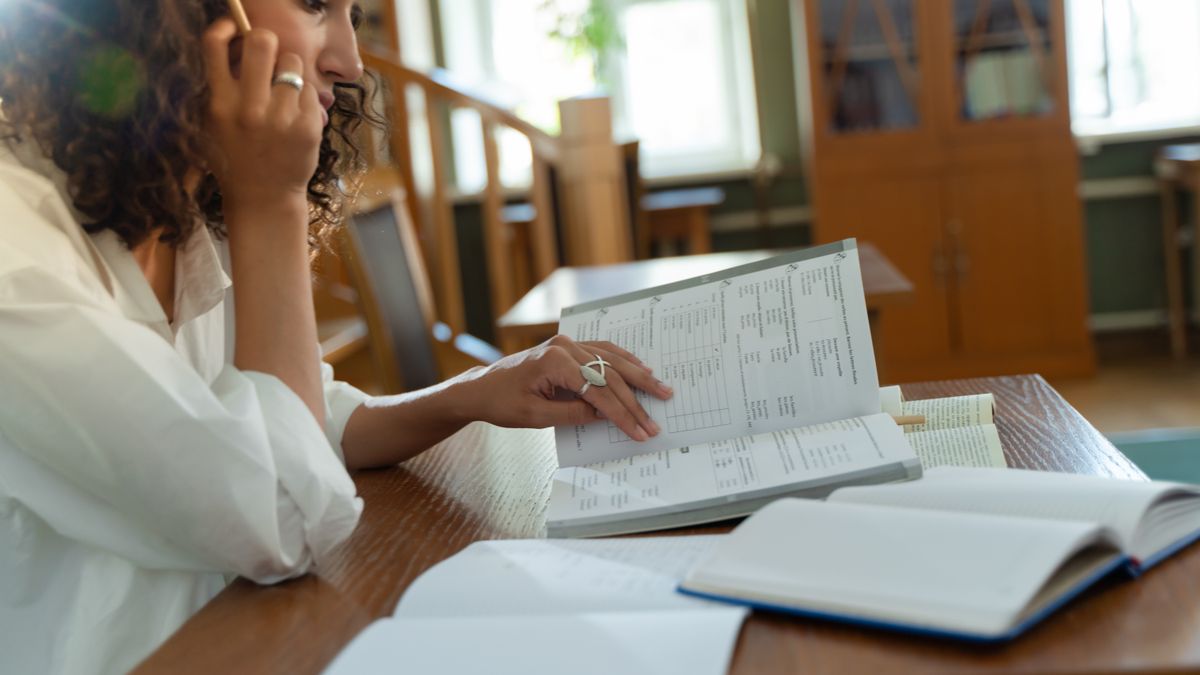 woman studying at desk notebook